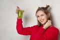 Cheerful girl holding glass of juice Royalty Free Stock Photo