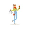 Cheerful girl holding iron cage, macaw parrot sitting on her hand. Full length portrait of young woman with colorful Royalty Free Stock Photo