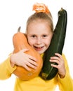Cheerful girl holding a pumpkin and squash Royalty Free Stock Photo