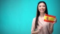 Cheerful girl holding Spain flag ready to learn foreign language, Spanish school