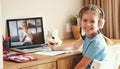 Cheerful girl during online lesson at home Royalty Free Stock Photo