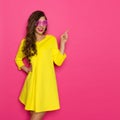 Cheerful Girl In Pink Sunglasses Pointing Royalty Free Stock Photo