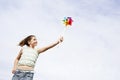 Cheerful Girl Playing With Pinwheel