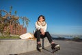 Cheerful girl rests after roller skating Royalty Free Stock Photo