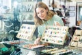 Girl trying on natural stone necklace Royalty Free Stock Photo