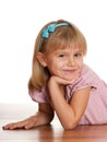 Cheerful girl on the wooden floor