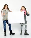 Cheerful girls holding blank board Royalty Free Stock Photo