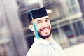 Cheerful graduate outside modern building