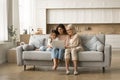 Cheerful grandma, mother and sweet little kid girl using laptop Royalty Free Stock Photo