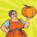 Cheerful grandmother with pumpkin for Thanksgiving