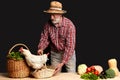 Cheerful gray-haired man going to sell vegetables and eggs from his farm