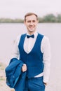 Cheerful groom. Half-length portrait. Beach location. Royalty Free Stock Photo