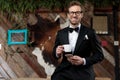 Cheerful groom holding a cup of coffee and smiling