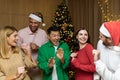 Cheerful Group friends celebrate New Year& x27;s party at home dancing together Christmas eve having fun. house New Year Royalty Free Stock Photo