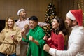 Cheerful Group friends celebrate New Year's party at home dancing together Christmas eve having fun. house New Year Royalty Free Stock Photo