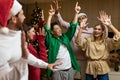 Cheerful Group friends celebrate New Year& x27;s party at home dancing together Christmas eve having fun. house New Year Royalty Free Stock Photo