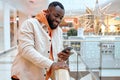 cheerful guy chatting with his girlfriend at mall Royalty Free Stock Photo