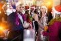 Guy with two girls on new year party in bar