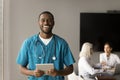 Cheerful handsome African American doctor professional portrait Royalty Free Stock Photo