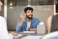 Cheerful handsome Arab entrepreneur man speaking to business partners Royalty Free Stock Photo