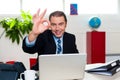 Cheerful handsome manager gesturing perfect sign Royalty Free Stock Photo