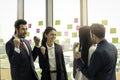 Cheerful and happy achievement successful businesspeople raising arm up to celebrate their success goal after presentation at Royalty Free Stock Photo