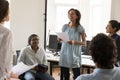 Cheerful happy African American employee speaking on business group meeting Royalty Free Stock Photo