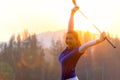 Cheerful happy asian smiling woman with a golf in the golf club in the sunny and evening sunset time, copy space.