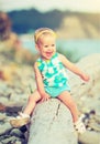 Cheerful happy baby girl laughing on walk in nature Royalty Free Stock Photo