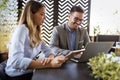 Cheerful coworkers in office working and brainstorming together Royalty Free Stock Photo