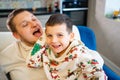 cheerful and happy dad and son fool around and play at home. family happiness. Royalty Free Stock Photo