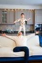 cheerful and happy dad and son fool around and play at home. family happiness. Royalty Free Stock Photo