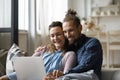 Cheerful happy family couple watching movie on laptop Royalty Free Stock Photo