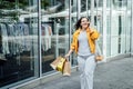 Cheerful happy plus size curvy woman talking on phone outdoors. Outdoor portrait of happy smiling candid plus size woman Royalty Free Stock Photo