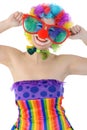 Cheerful happy smiling clown with big funny glasses and red nose in studio Royalty Free Stock Photo