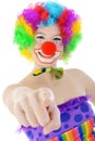 Cheerful happy smiling clown points at viewer in studio Royalty Free Stock Photo