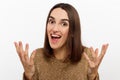 Cheerful happy young beautiful girl looking at camera smiling laughing over white background. Royalty Free Stock Photo