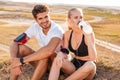 Cheerful healthy couple resting together with bottle of water Royalty Free Stock Photo