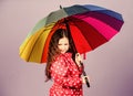 Cheerful hipster child in positive mood. autumn fashion. happy little girl with colorful umbrella. rain protection
