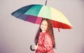 Cheerful hipster child in positive mood. rain protection. Rainbow. happy little girl with colorful umbrella. little girl Royalty Free Stock Photo