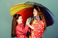 Cheerful hipster children, sisterhood. rain protection. Rainbow. family bonds. Little girls in raincoat. happy little