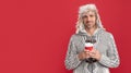 cheerful hoary man drinking coffee. male fashion model hold cup. winter fashion.