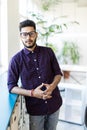 Cheerful indian business man standing near the window Royalty Free Stock Photo