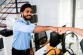 Cheerful Indian businessman partners making fist bump with a smile as a symbol of teamwork. Positive multi-ethnic business