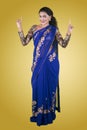 Cheerful Indian woman with blue saree clothes