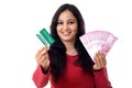 Cheerful Indian woman holdingIndian rupee and credit card