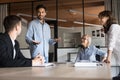 Cheerful inspired young Indian professional man presenting project plan Royalty Free Stock Photo