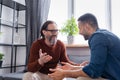 cheerful interracial father and son gesturing