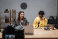 cheerful interracial podcasters in headphones working Royalty Free Stock Photo