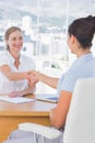 Cheerful interviewer shaking hand of an applicant Royalty Free Stock Photo